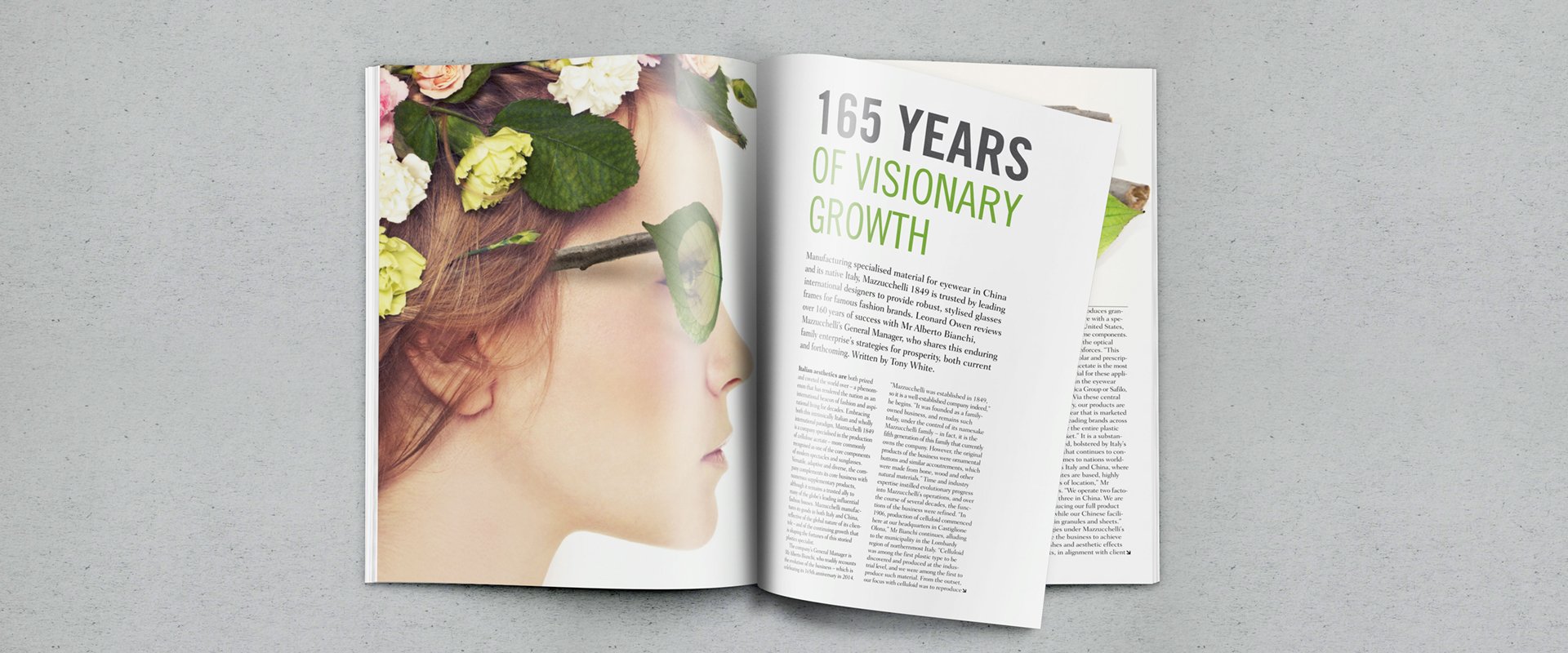 Publication layout design for an eyewear company showing a woman wearing 'natural' glasses and using clean bold typography.